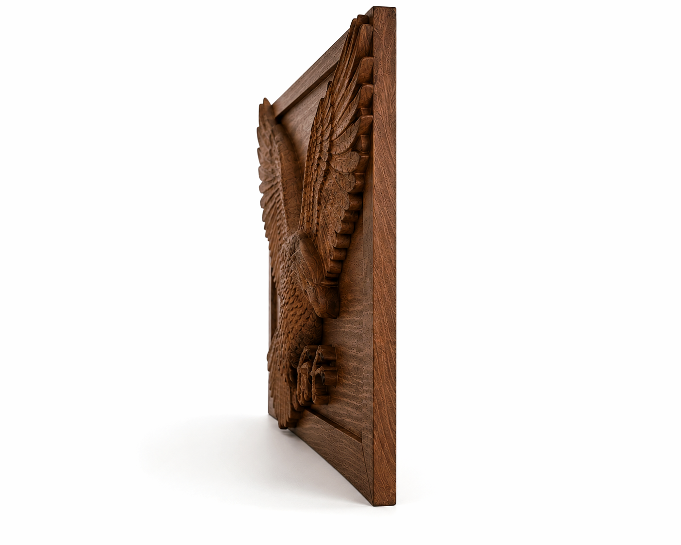 Side view of a carved solid beech eagle panel, showing the thickness of the panel, the three-dimensional relief of the wings, and the depth of the artistic carving