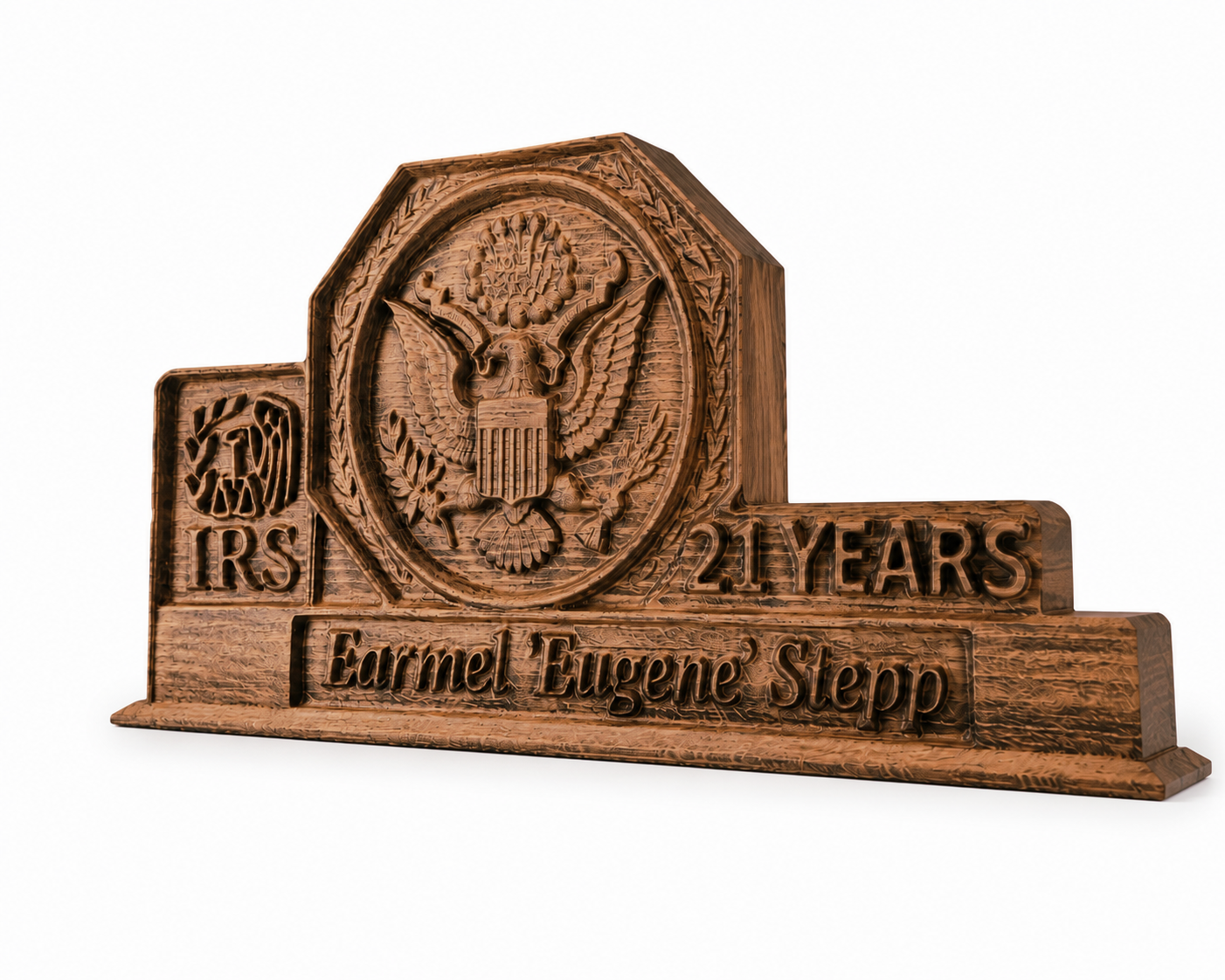 Personalized wooden award for 21 years of service with embossed American eagle, IRS logo and engraved name, shot on a white background at an angle