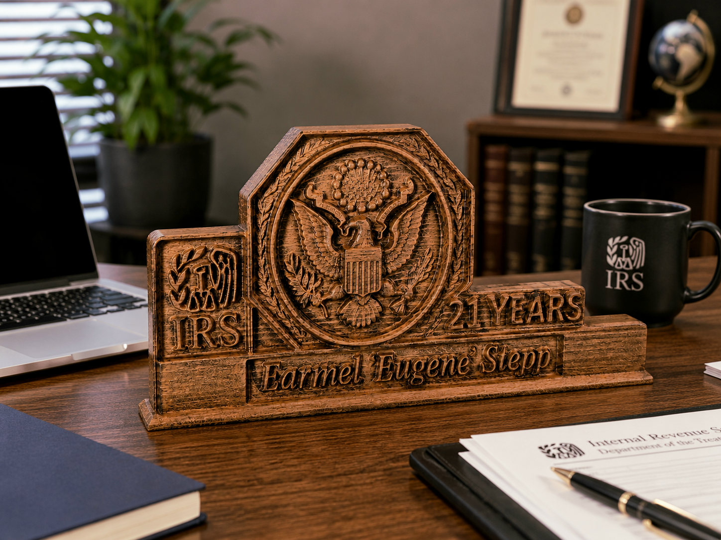 Personalized wooden anniversary plaque for 21 years of service, placed on an office desk in a professional work environment, with an engraved name and detailed embossed design